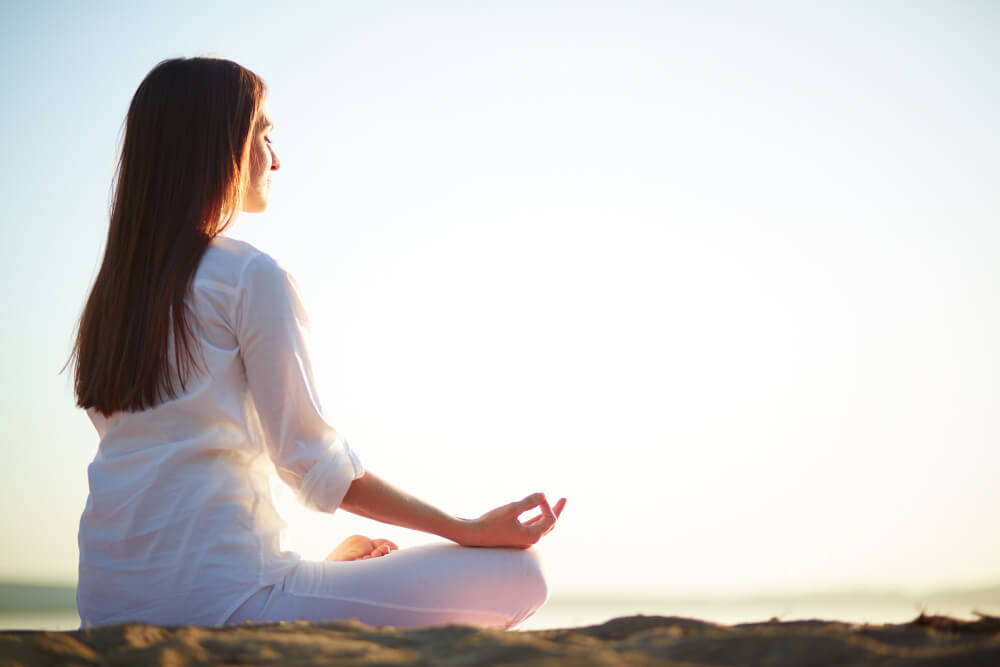 woman-sitting-yoga-pose-beach (1)